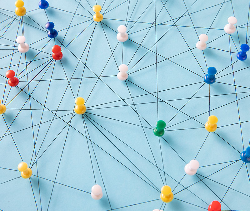 A detective board shows push pins connected by thread, alluding to the topic ‘can someone track my phone?’