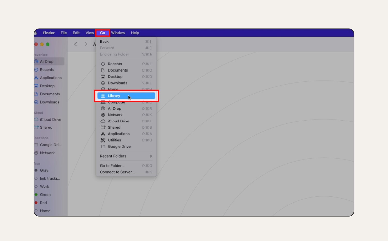 A screenshot showing how to open 'Library' in the 'Go’ menu. 