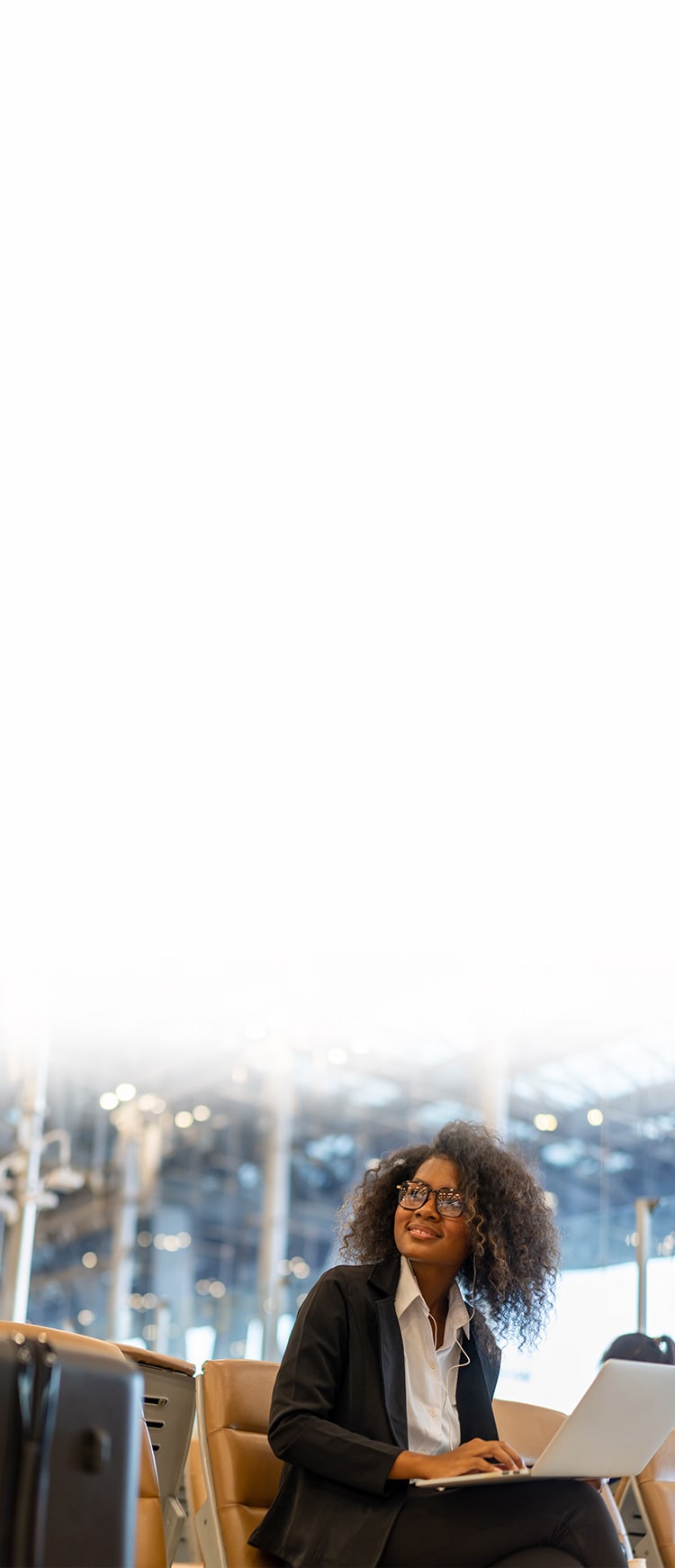 A woman uses a free VPN trial to connect to public Wi-Fi in an airport.