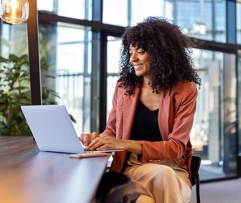 A woman checking if her VPN is working on her laptop.