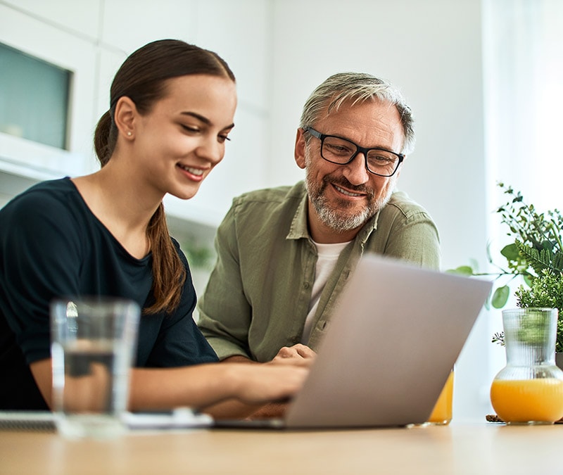A woman reveals her search history to a friendly man in green.