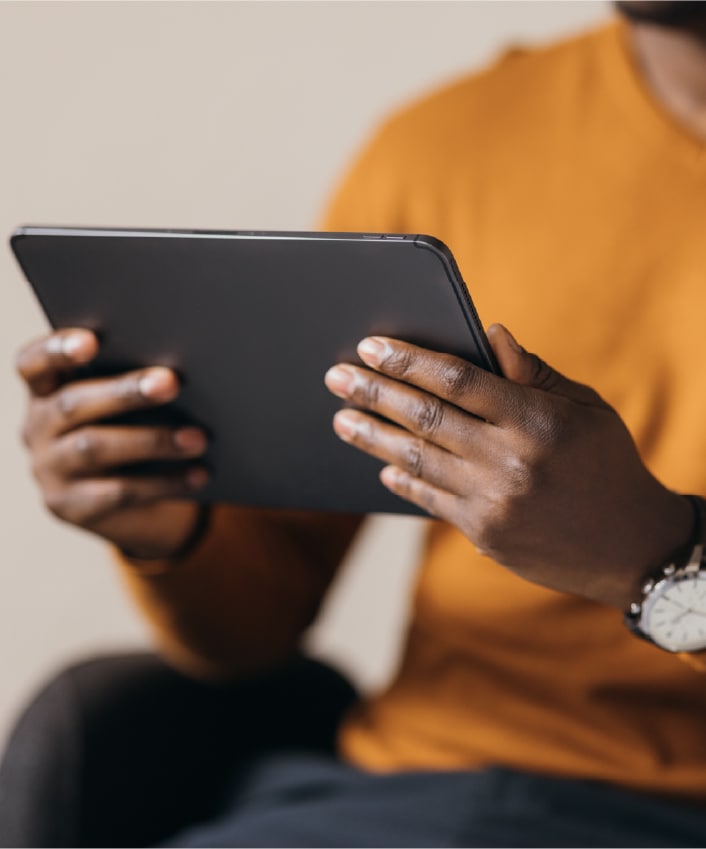 A person reads about data brokers on their tablet.