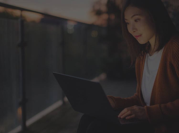 Woman on a laptop searching Norton Free Tools