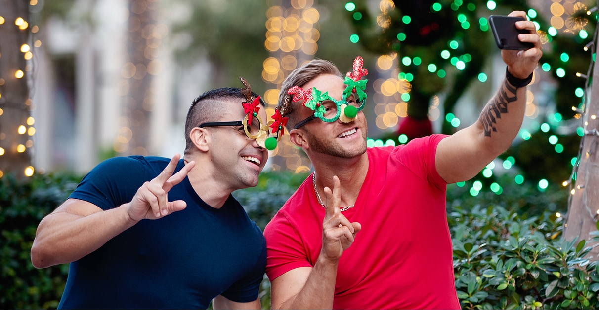 man and woman looking at a mobile phone