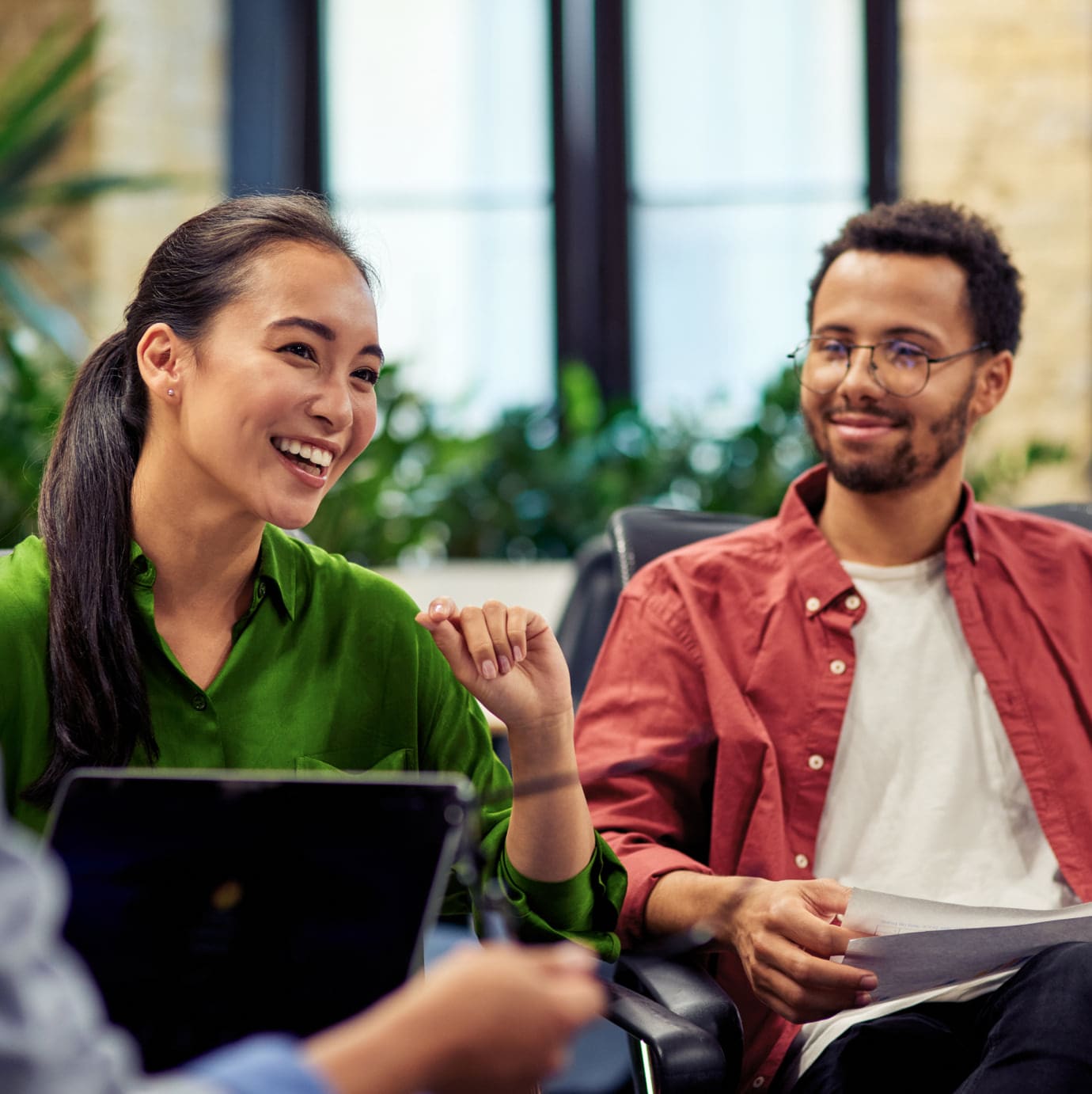 Group of people sitting together and smiling