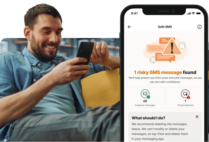 Man sitting looking at phone with risky message alert
